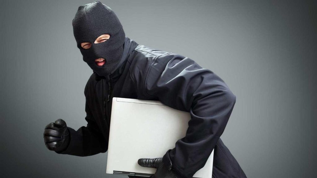 person stealing laptop for stolen device
